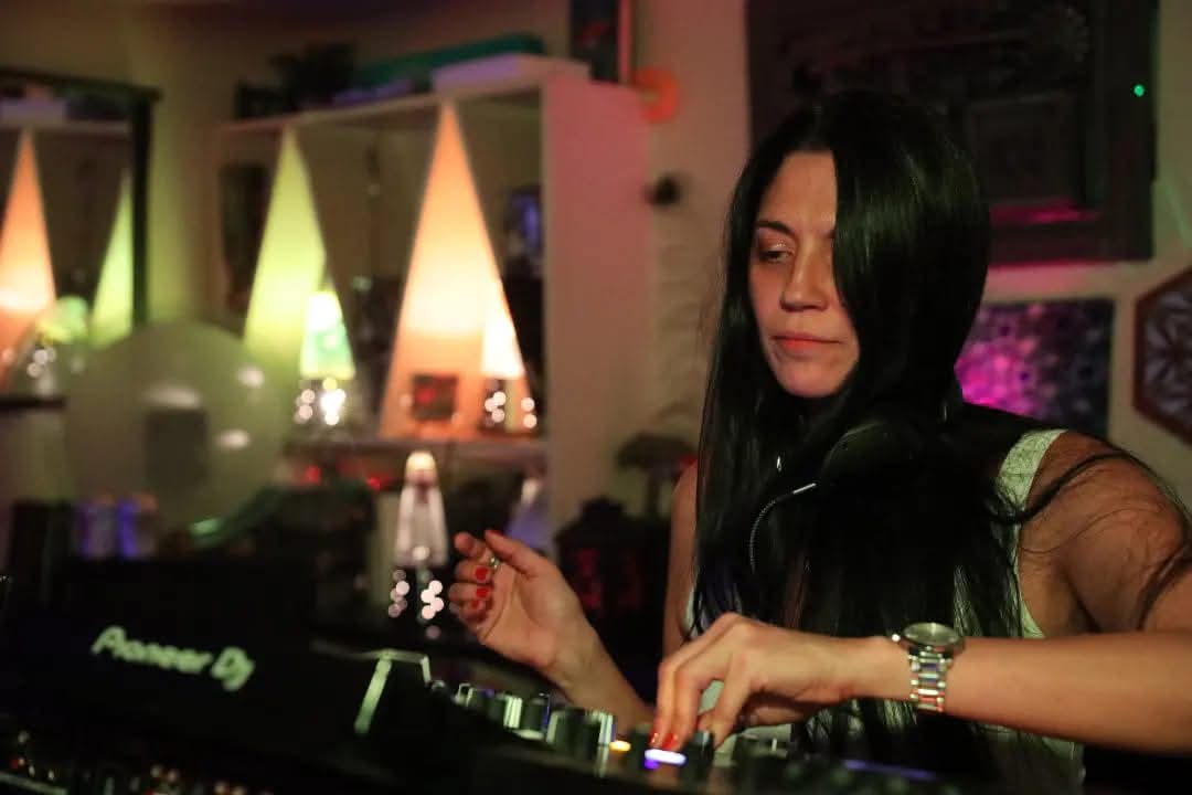 BELLA~B DJing with colorful lighting