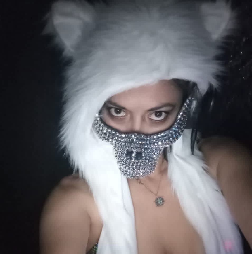 BELLA~B wearing a fuzzy headdress and mask